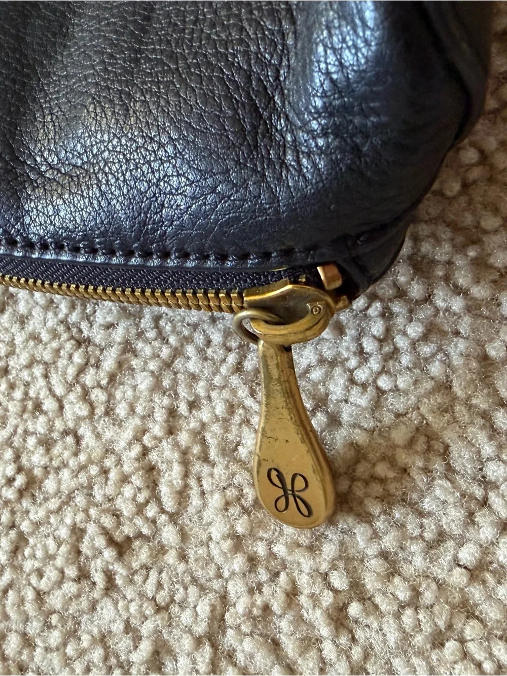 HOBO Black Pebbled Leather Crossbody with Tassel and Gold Hardware